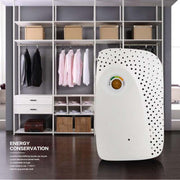 Compact white home mini dehumidifier with moisture indicator light in a modern closet setting