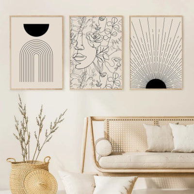 Boho Canvas trio of abstract line art prints with minimalist black and beige designs in a cozy living room setting