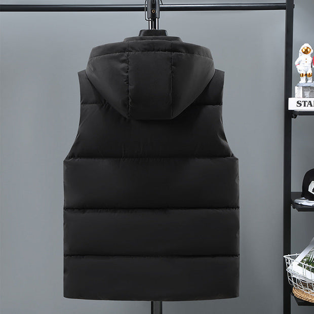 Black thickened vest for men with removable hood, padded design, and straight hem, displayed from the back on a hanger.