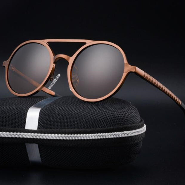 Round sunglasses with durable, lightweight lens material and UV400 protection on a black case.